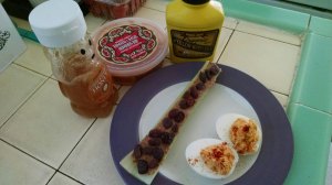 devilled eggs and ants on a log